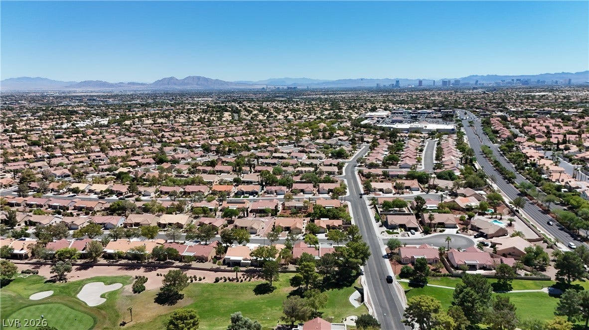 Panoramas of the surrounding valley and distant skyline unfold from this elevated neighborhood vantage point.