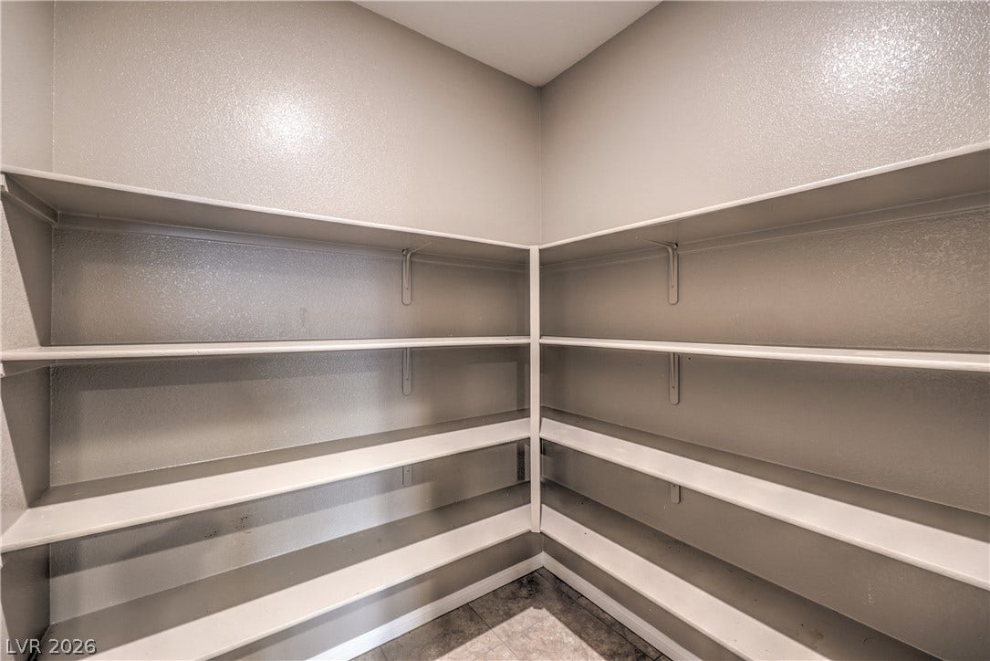 4658 Chestnut Tiger Street, North Las Vegas, NV 89031 Generous wrap-around shelving highlights this functional, tiled storage space.