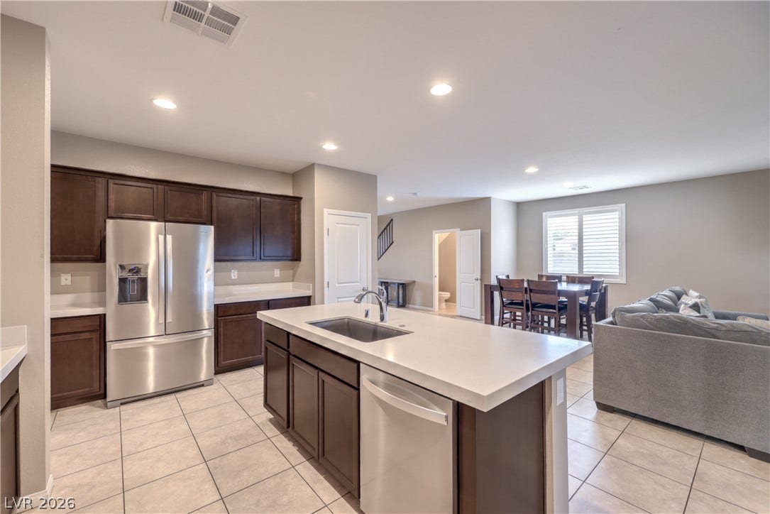 4658 Chestnut Tiger Street, North Las Vegas, NV 89031 An open floorplan seamlessly connects the kitchen with the adjacent dining and living areas.