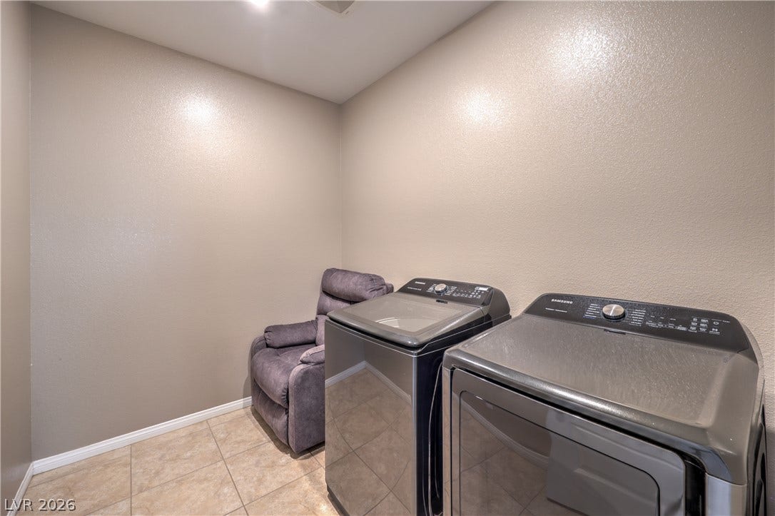 4658 Chestnut Tiger Street, North Las Vegas, NV 89031 Durable tile flooring grounds this dedicated laundry space complete with laundry hookups.