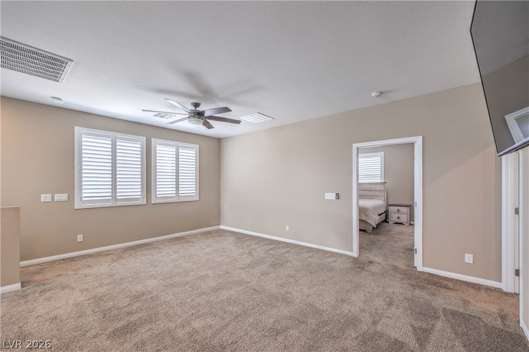 4658 Chestnut Tiger Street, North Las Vegas, NV 89031 Plush carpeting and plantation shutters define this versatile upper-level bonus space.