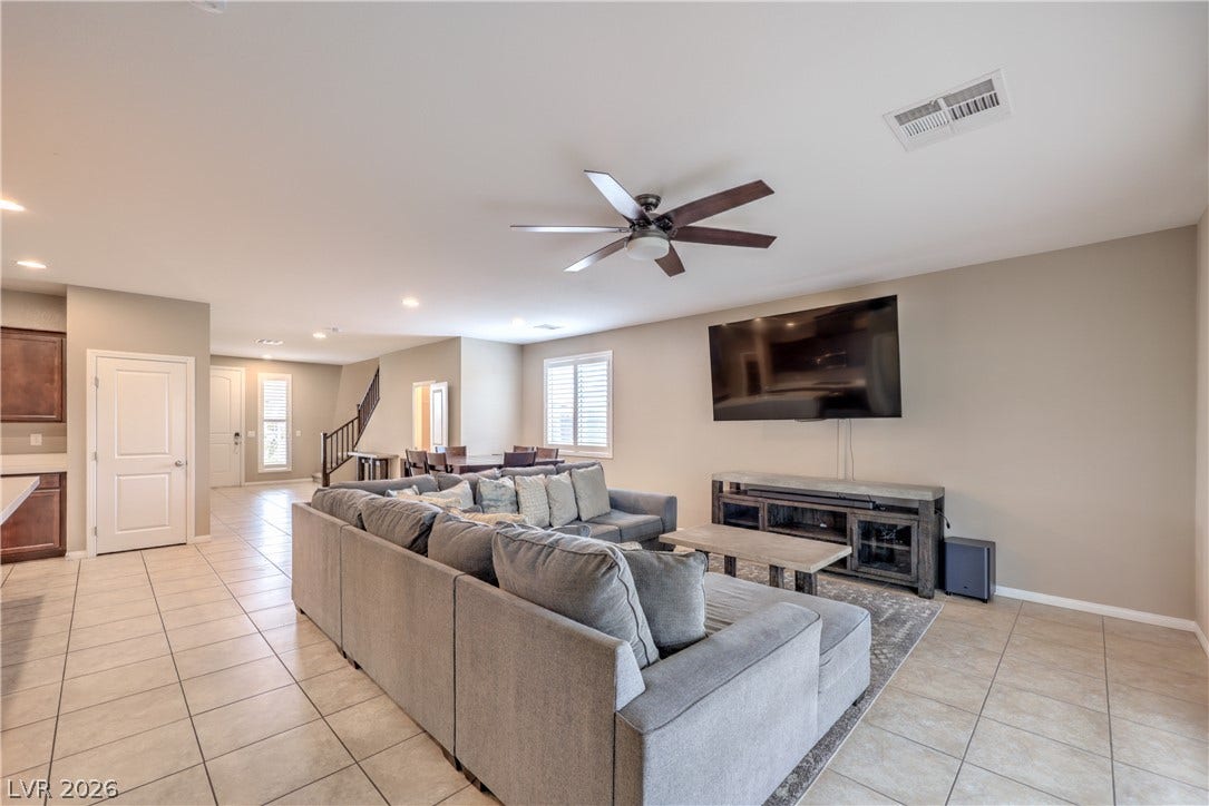 4658 Chestnut Tiger Street, North Las Vegas, NV 89031 An open floorplan seamlessly connects the airy living space to adjacent dining and kitchen areas.