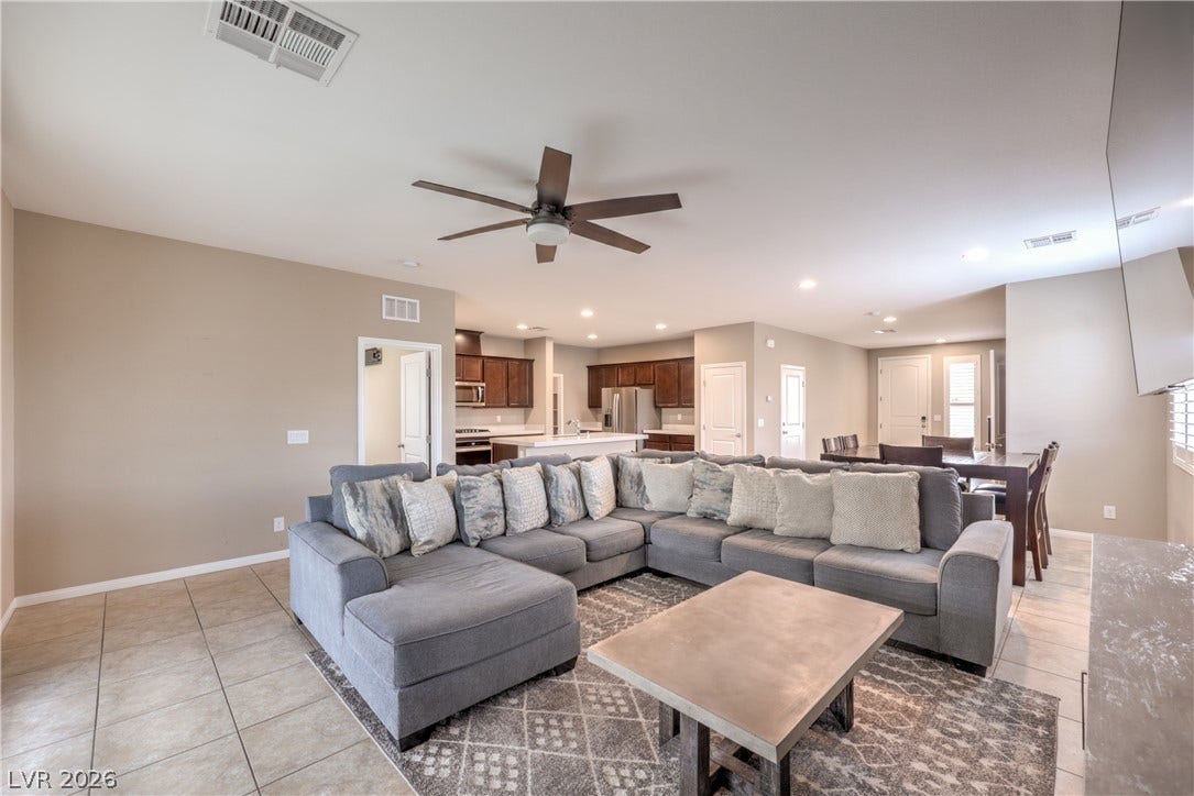 4658 Chestnut Tiger Street, North Las Vegas, NV 89031 Tiled flooring and recessed lighting define this inviting, open-concept layout.
