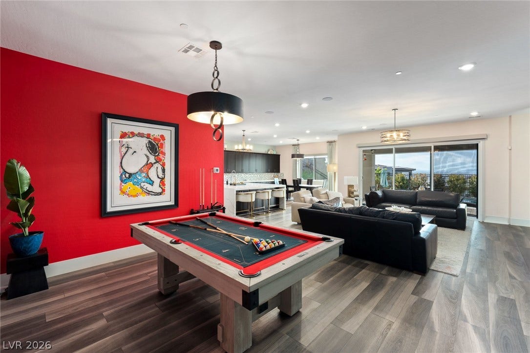 An open floorplan design seamlessly connects the spacious recreation area to the main living spaces.