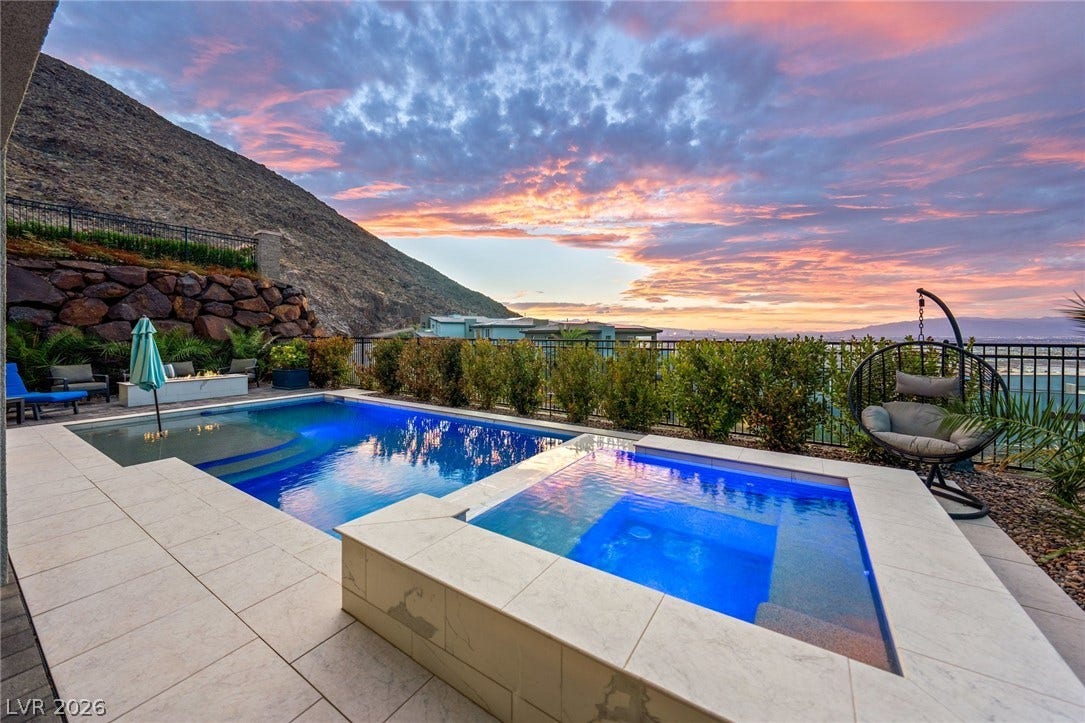 Dramatic mountain vistas provide a scenic backdrop for the custom pool and spa terrace.