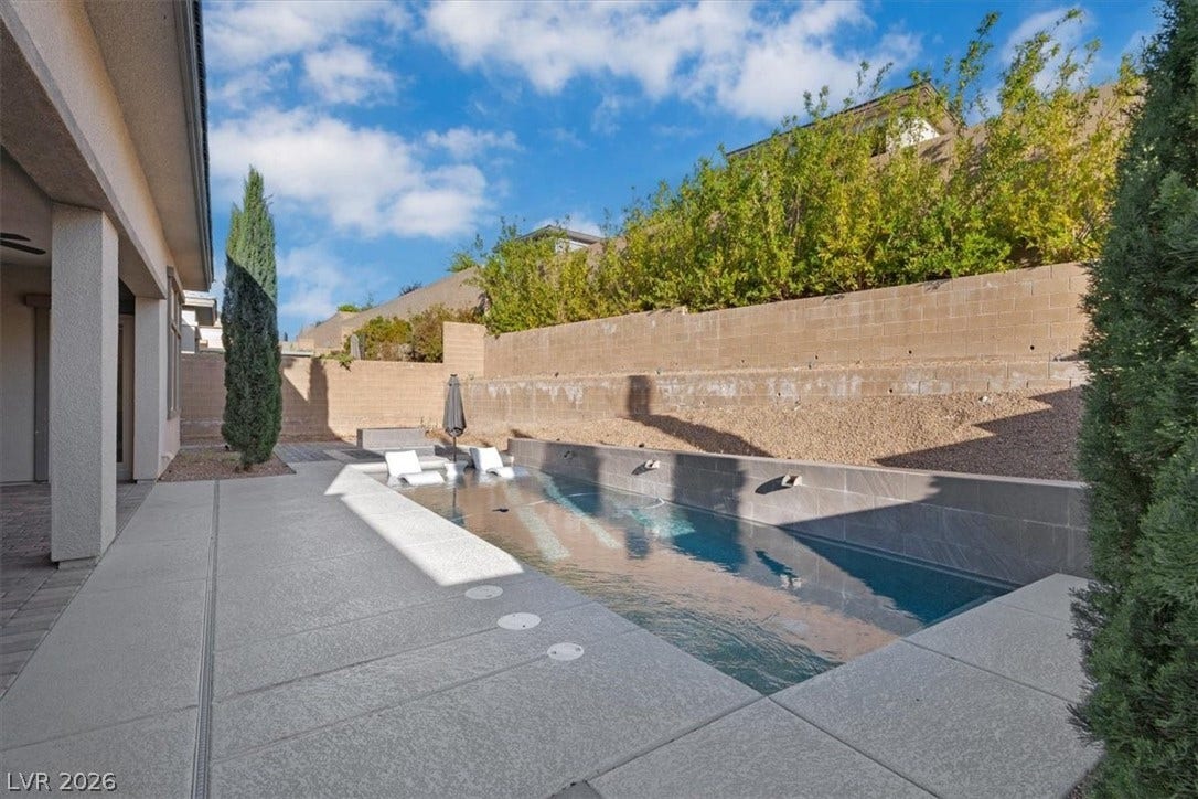 Private backyard oasis with pool, fire pit and dry bar with fridge and TV