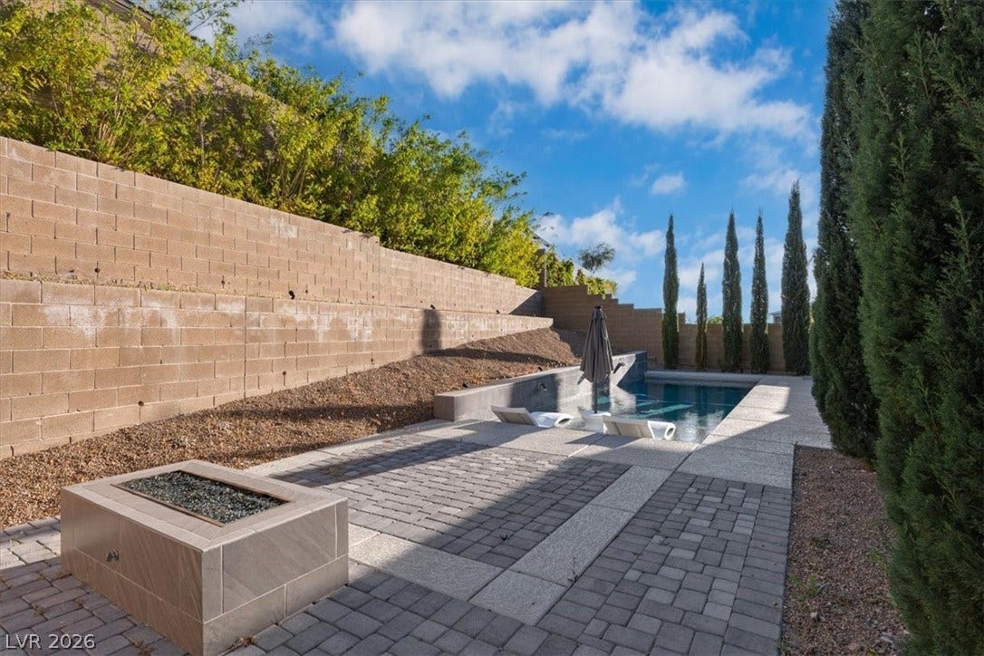 Private backyard oasis with pool, fire pit and dry bar with fridge and TV