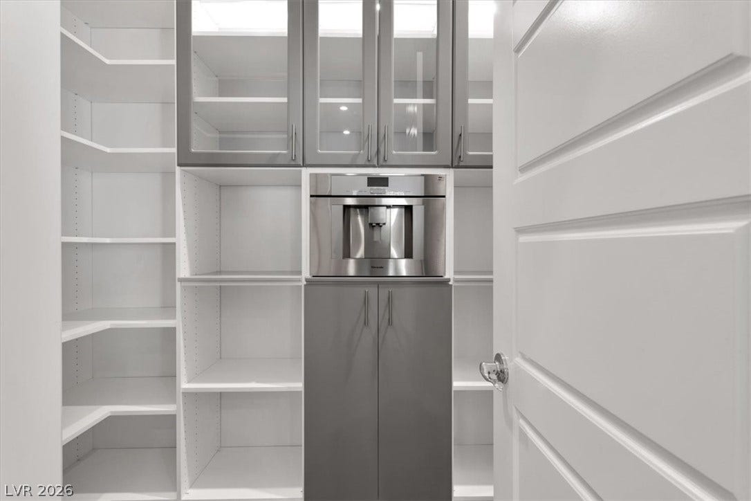 View of walk in pantry featuring Thermador coffee maker