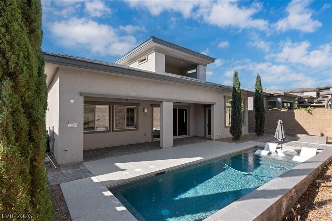 Private yard with pool featuring Baja beach, seating and fire pit near pool for seamless entertaining
