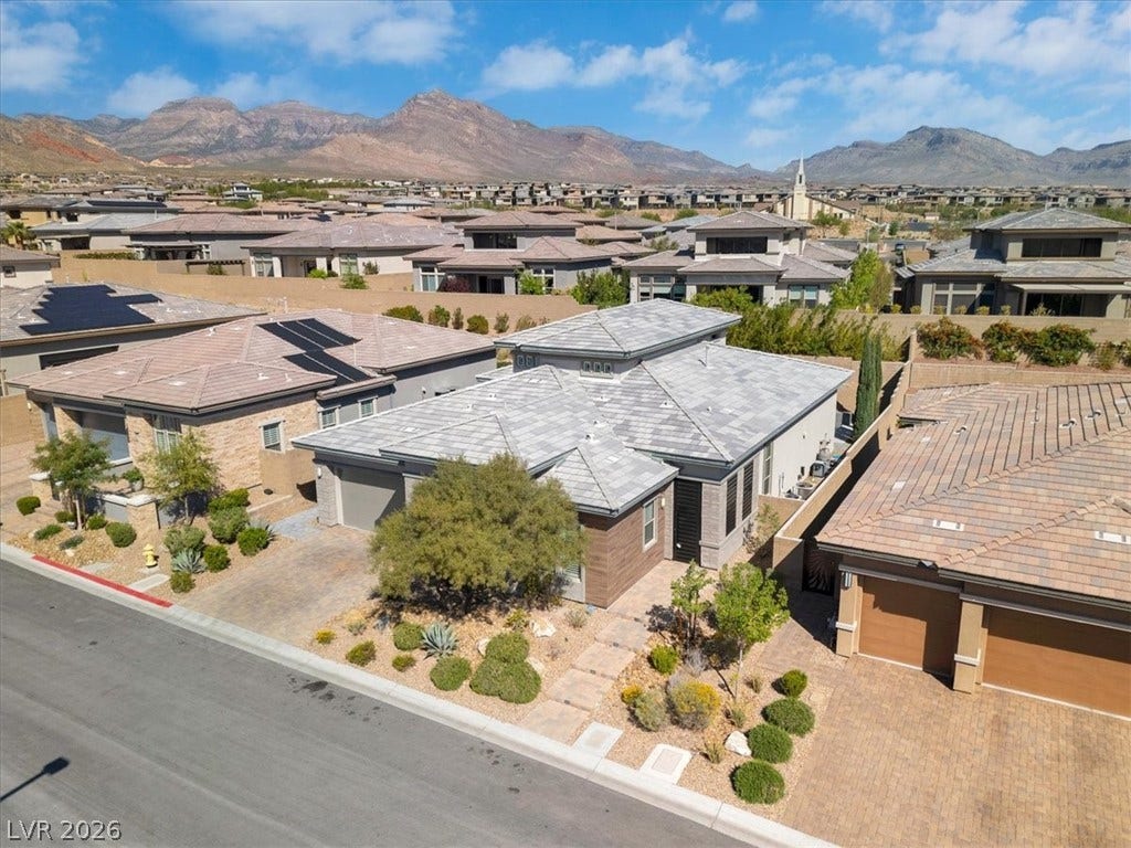 Aerial view of residential area featuring mountains