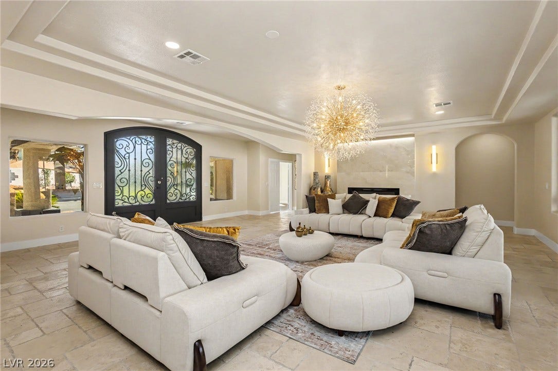 Gleaming tile floors and multi-layered tray ceilings define this grand central gathering space.