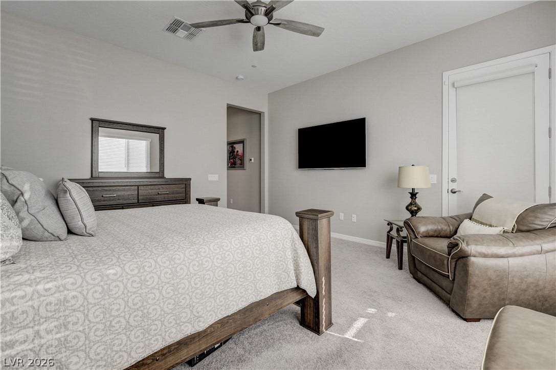 51 Thorn Creek Street, Henderson, NV 89011 Bedroom with light carpet and ceiling fan