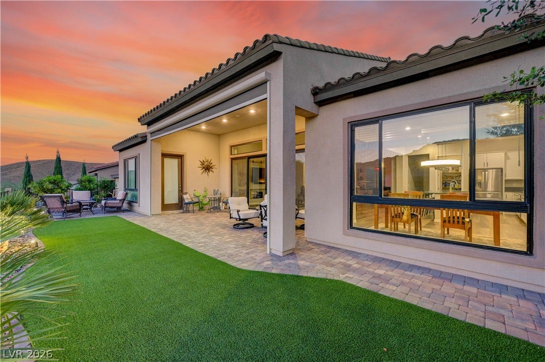 51 Thorn Creek Street, Henderson, NV 89011 Back of house featuring a tiled roof, a patio area, stucco siding, and a lawn