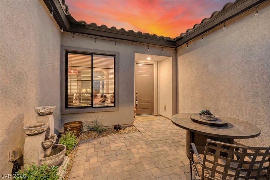 51 Thorn Creek Street, Henderson, NV 89011 An inviting stone-paved courtyard provides a private entry under a Spanish tile roof.