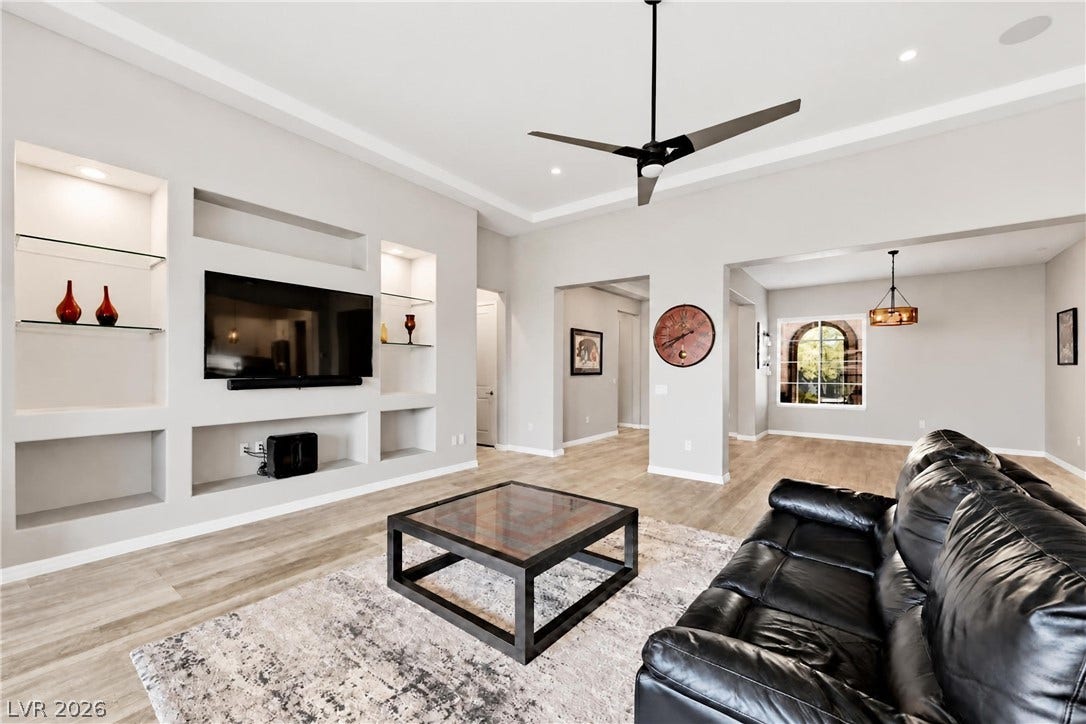 51 Thorn Creek Street, Henderson, NV 89011 An open floorplan connects the living spaces under high tray ceilings with recessed lighting.
