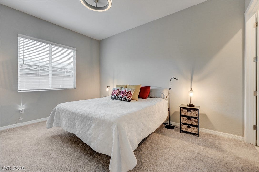 51 Thorn Creek Street, Henderson, NV 89011 Bedroom with light carpet and baseboards