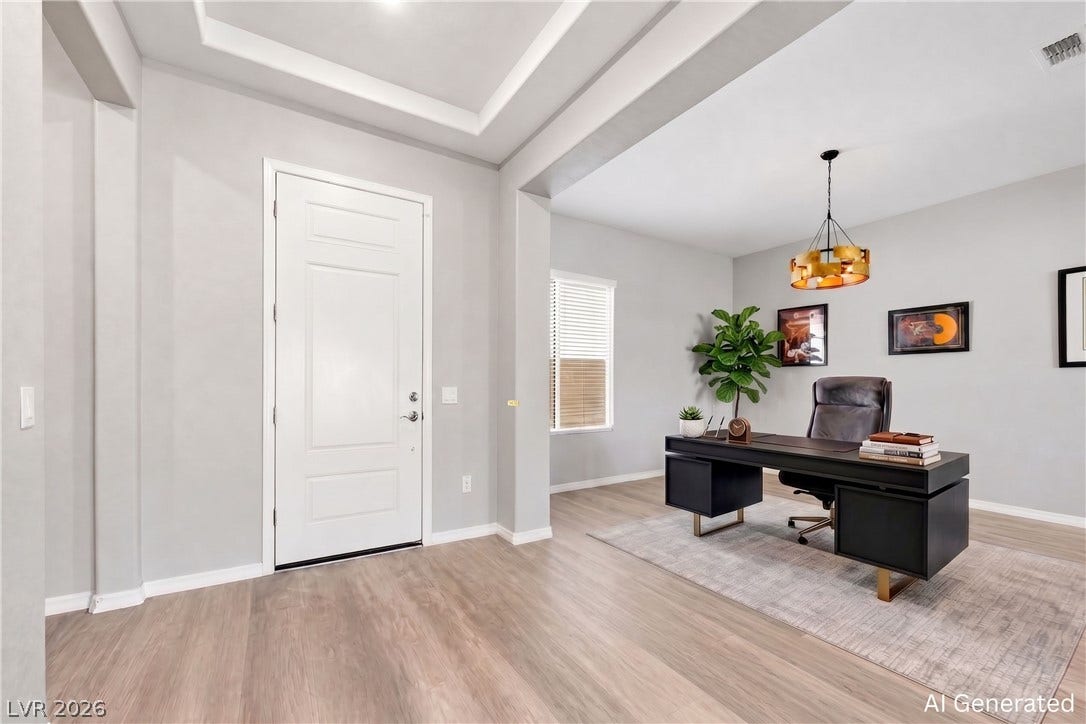 51 Thorn Creek Street, Henderson, NV 89011 An inviting entrance foyer transitions seamlessly into a versatile home office with wood flooring. AI-generated image.