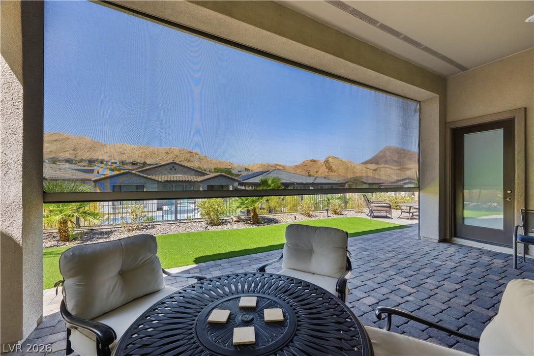 51 Thorn Creek Street, Henderson, NV 89011 A shaded patio opens to paved surfaces and picturesque mountain views.