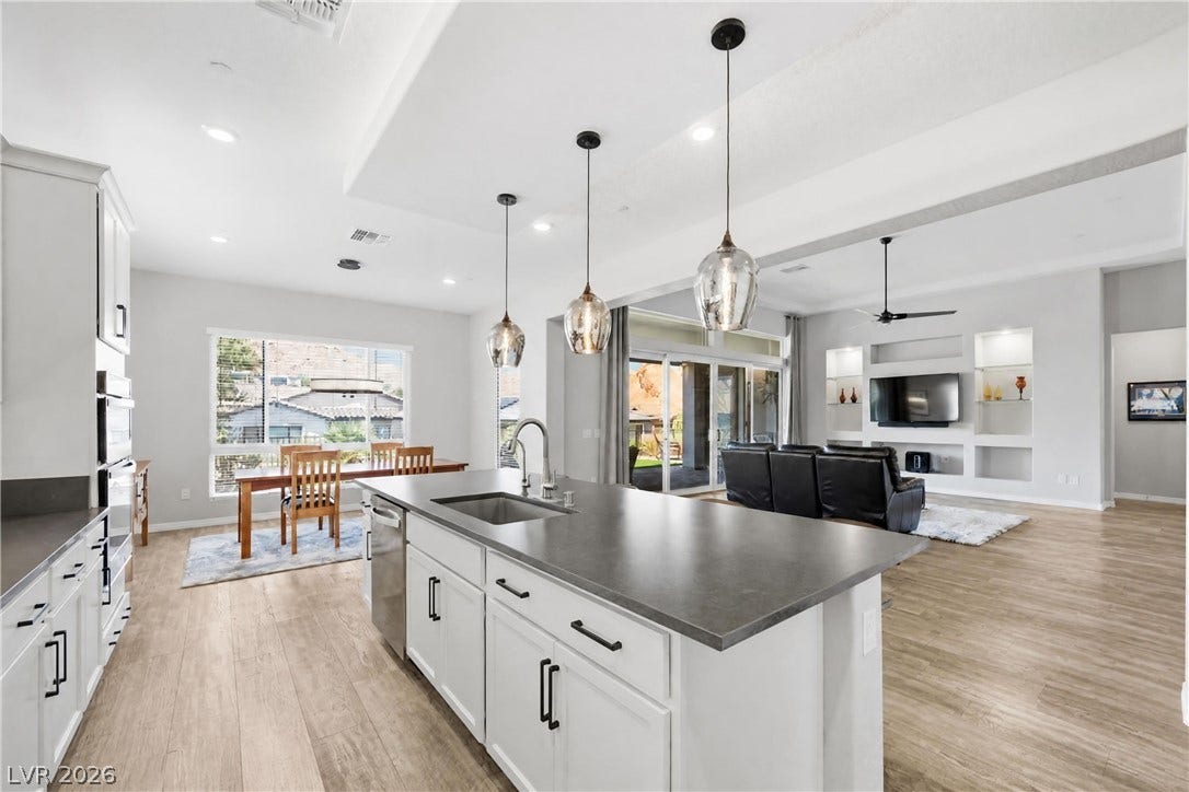 51 Thorn Creek Street, Henderson, NV 89011 An open concept design seamlessly connects the modern kitchen workspace to the adjacent living areas.