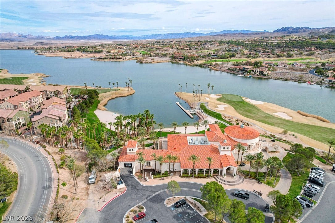 51 Thorn Creek Street, Henderson, NV 89011 Aerial perspective of suburban area with a water and mountain view and a golf course