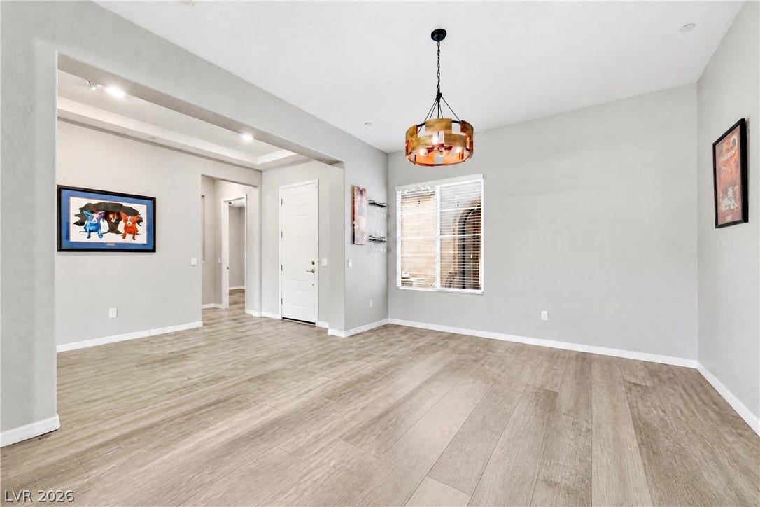 51 Thorn Creek Street, Henderson, NV 89011 Smooth wood-look flooring and clean lines define this versatile, open-concept living space.
