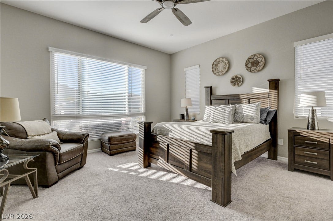 51 Thorn Creek Street, Henderson, NV 89011 Bedroom featuring light colored carpet and a ceiling fan