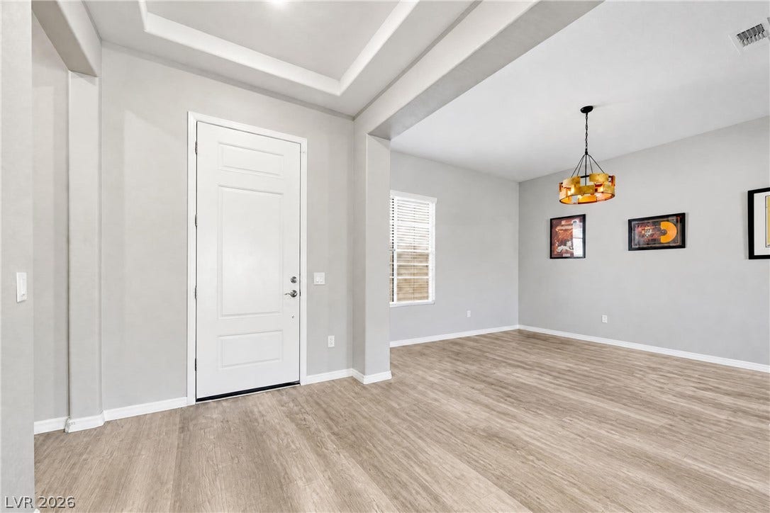 51 Thorn Creek Street, Henderson, NV 89011 Clean lines and tray ceilings define this welcoming entry that flows into the dining area.