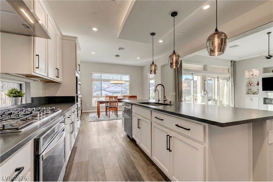 51 Thorn Creek Street, Henderson, NV 89011 An open floorplan seamlessly connects this culinary space to the surrounding living areas.