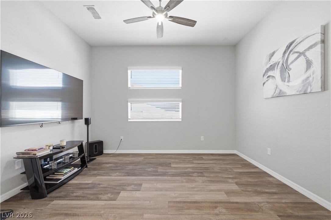 51 Thorn Creek Street, Henderson, NV 89011 Smooth wood-look flooring and stacked horizontal windows enrich this restful next-gen optional bedroom.