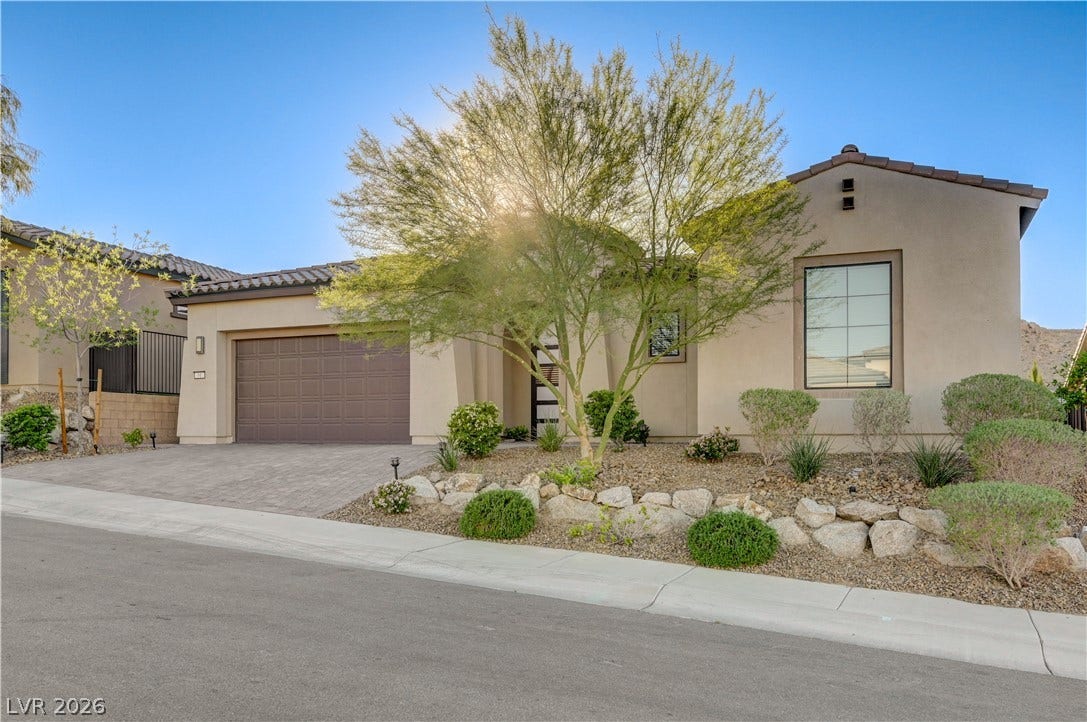 51 Thorn Creek Street, Henderson, NV 89011 Mediterranean / spanish-style home with driveway, a garage, stucco siding, and a tile roof