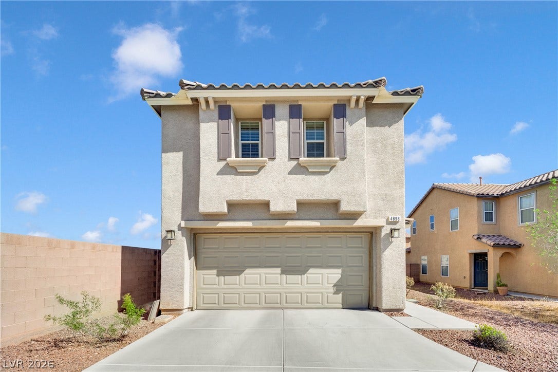 Stucco cladding and a tiled roof complement the clean lines of this modern exterior.