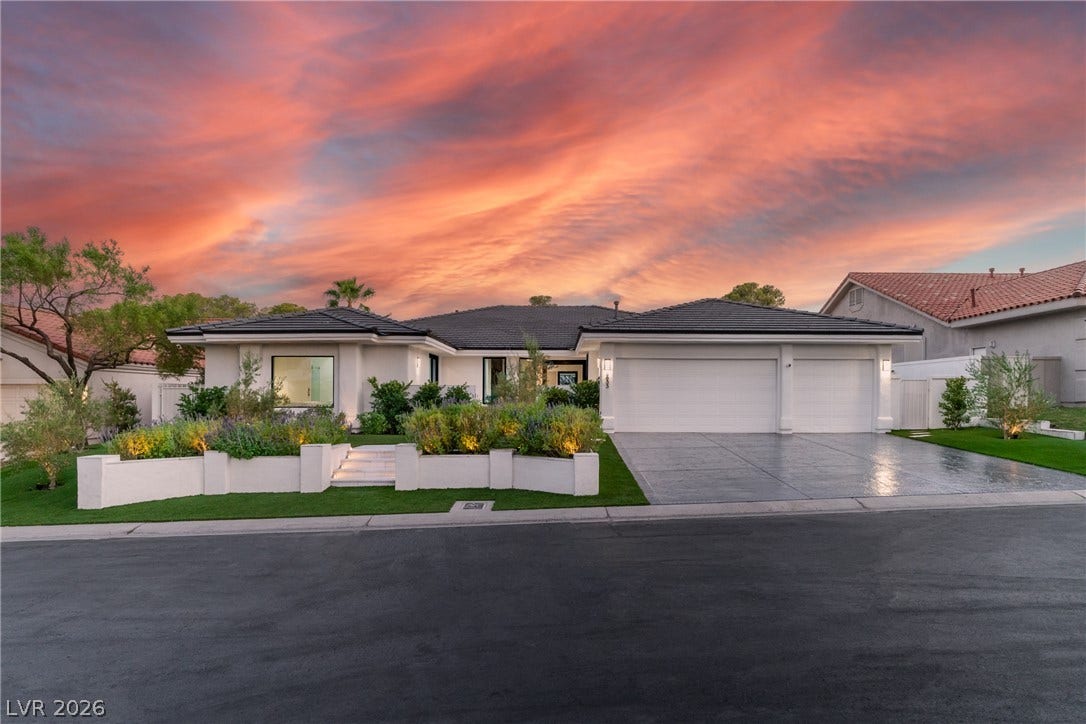 8633 Robinson Ridge Drive, Las Vegas, NV 89117 Lush landscaping and custom hardscaping lead to this modern single-story residence with a multi-car garage.