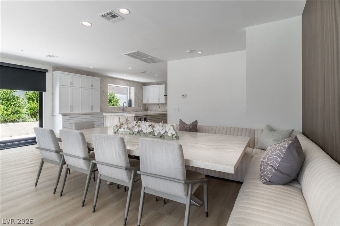 8633 Robinson Ridge Drive, Las Vegas, NV 89117 Clean lines and smooth light wood flooring define this elegant contemporary dining area.