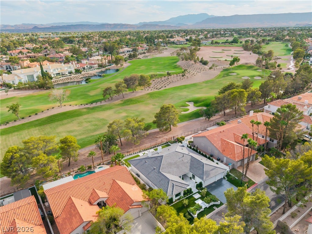 8633 Robinson Ridge Drive, Las Vegas, NV 89117 Lush fairways and distant mountains frame this exceptional golf course community home.