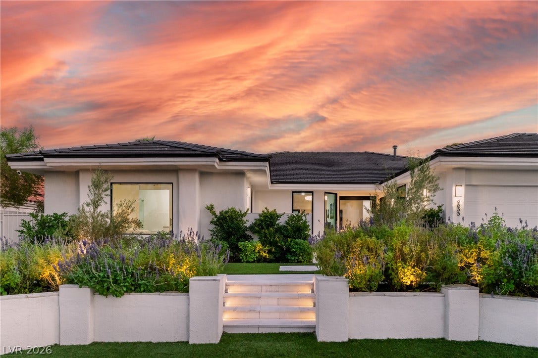 8633 Robinson Ridge Drive, Las Vegas, NV 89117 Lush landscaping and stone steps guide the way to a modern stucco exterior.