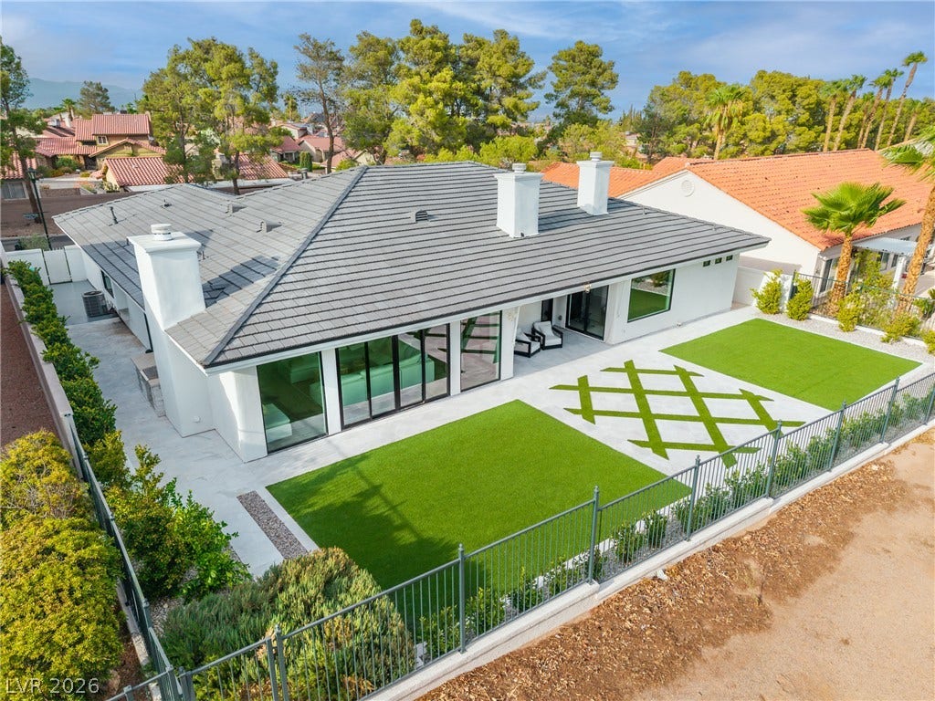 8633 Robinson Ridge Drive, Las Vegas, NV 89117 Crisp white stucco and a sleek tile roof define this modern single-story residence.