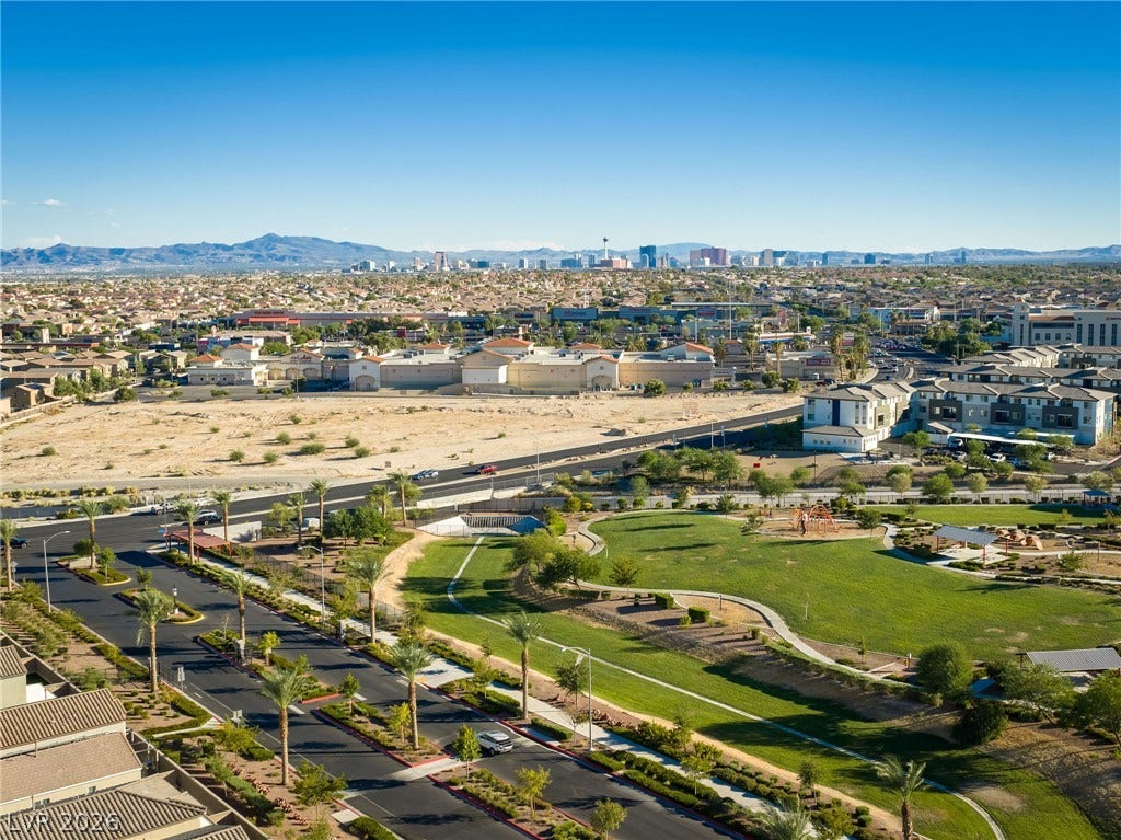 4605 Fragrant Street, North Las Vegas, NV 89031 Sweeping valley vistas highlight the city skyline against a dramatic mountain backdrop.