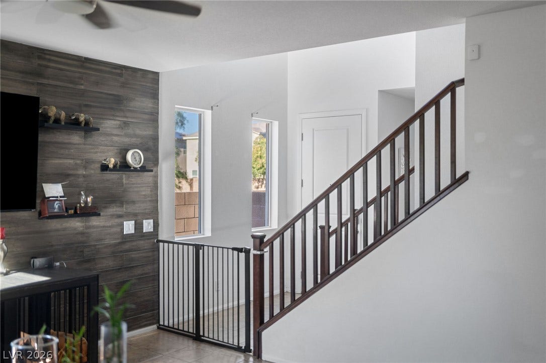 4605 Fragrant Street, North Las Vegas, NV 89031 Clean lines and a handsome wooden railing highlight the staircase in this welcoming entryway.