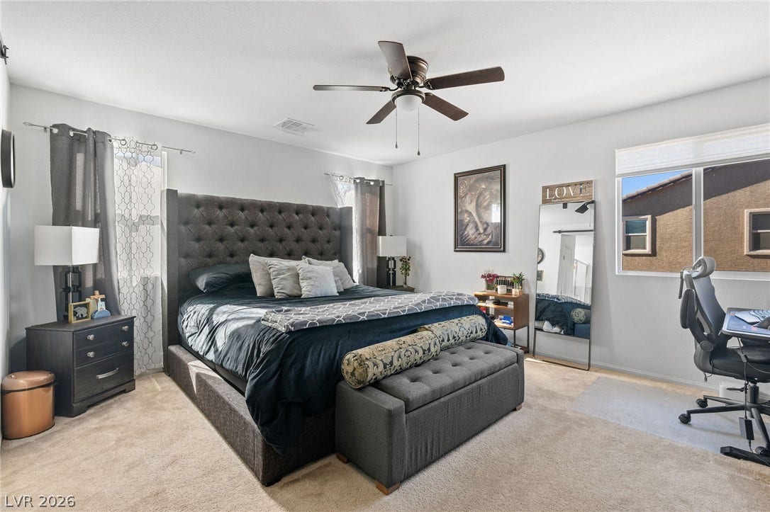 4605 Fragrant Street, North Las Vegas, NV 89031 Master Bedroom, soft carpeting pairs with natural light streaming through windows in this comfortable bedroom space.