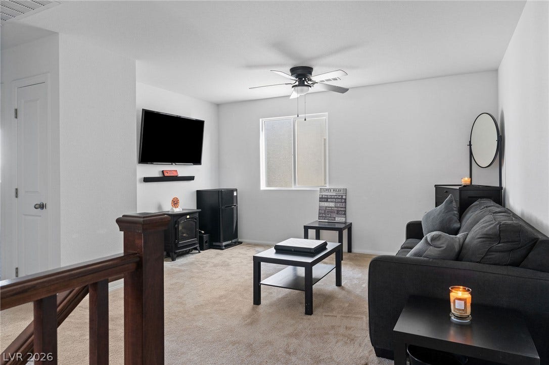 4605 Fragrant Street, North Las Vegas, NV 89031 Plush wall-to-wall carpeting and clean white walls define this comfortable upper-level living area.