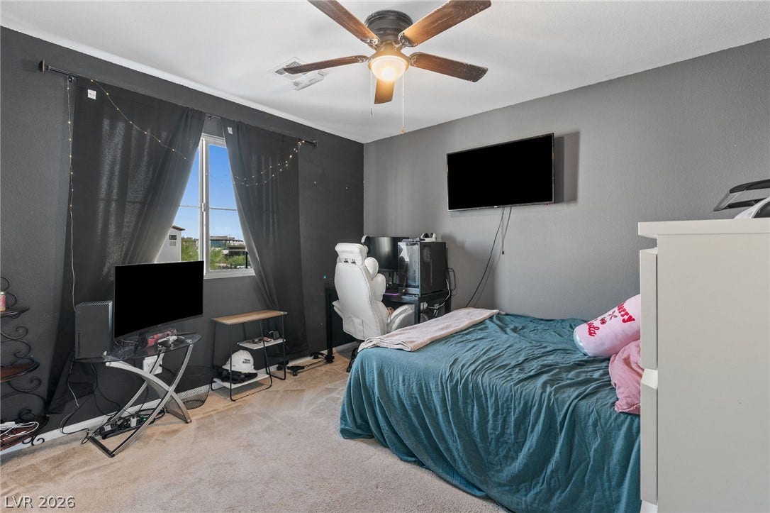 4605 Fragrant Street, North Las Vegas, NV 89031 A single window draws natural light into this cozy bedroom featuring soft carpeting.