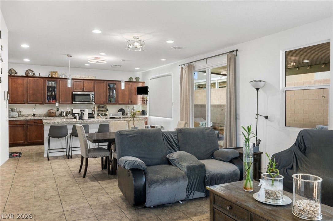 4605 Fragrant Street, North Las Vegas, NV 89031 An open floorplan seamlessly connects the comfortable living area directly into the modern kitchen.