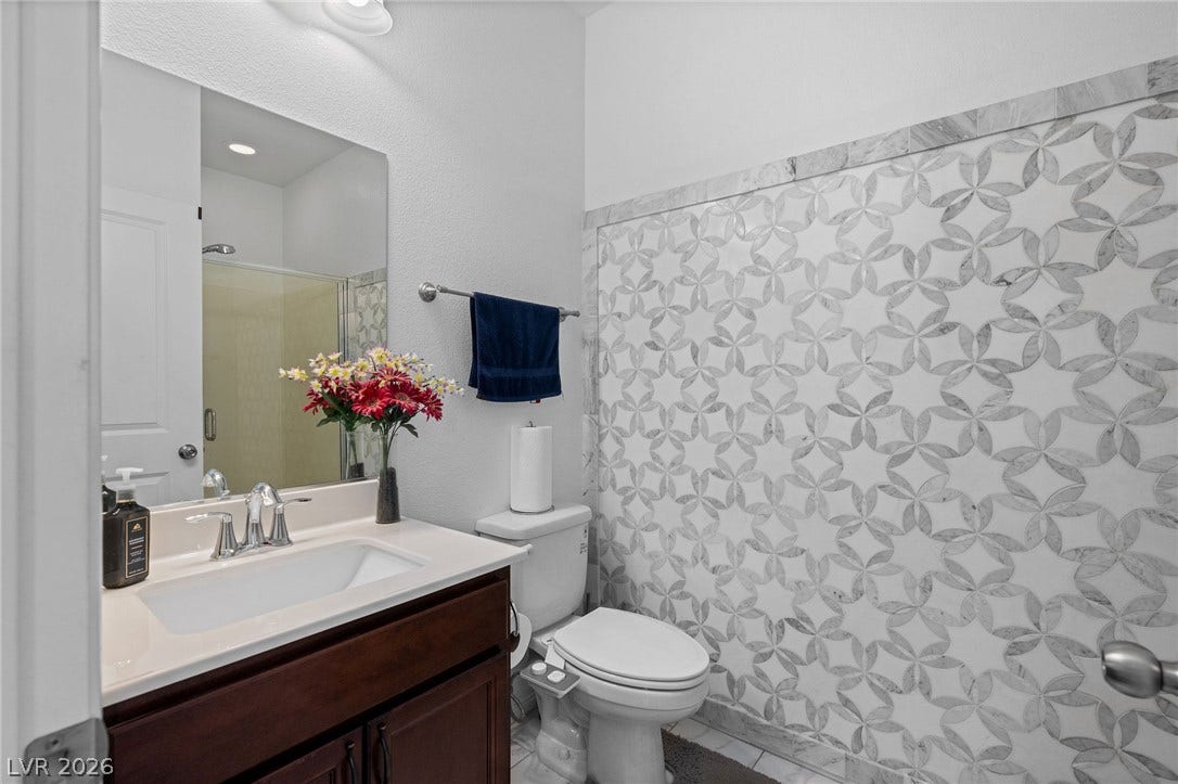 4605 Fragrant Street, North Las Vegas, NV 89031 Downstairs bathroom, tile accents create a memorable focal point in this refined powder room.