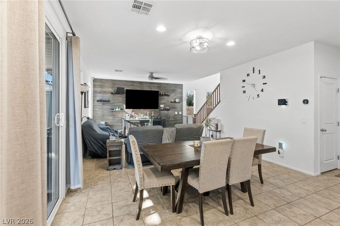 4605 Fragrant Street, North Las Vegas, NV 89031 An open floor plan connects the dining area to a living space featuring tile flooring.