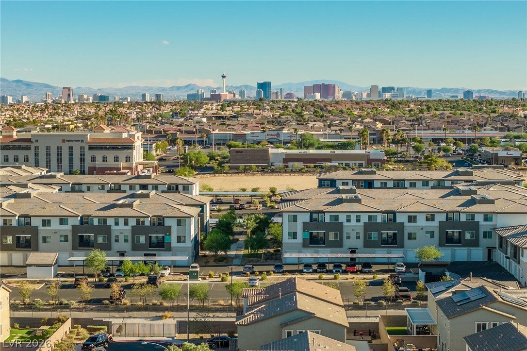 4605 Fragrant Street, North Las Vegas, NV 89031 Panoramic mountain and skyline views overlook the surrounding neighborhood under clear blue skies.