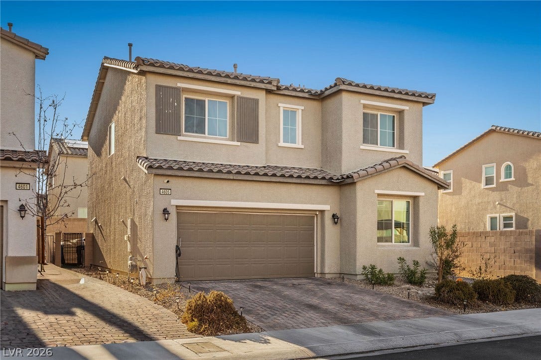 4605 Fragrant Street, North Las Vegas, NV 89031 Stucco cladding and a tiled roof define this contemporary two-story home with an attached garage.