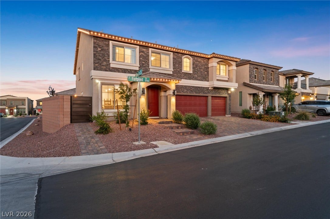 8724 Fortplaid Street, Las Vegas, NV 89139 Striking stone accents and a paved driveway enhance this modern two-story corner lot home.