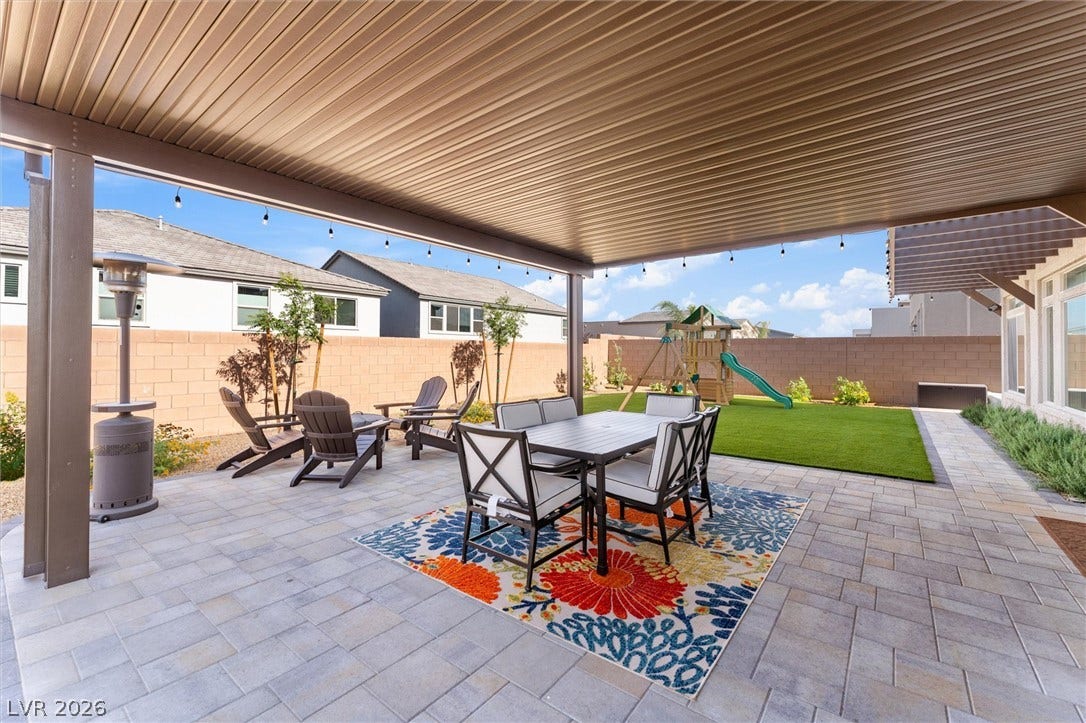 8724 Fortplaid Street, Las Vegas, NV 89139 A spacious covered patio paved in stone overlooks a private, fenced backyard.