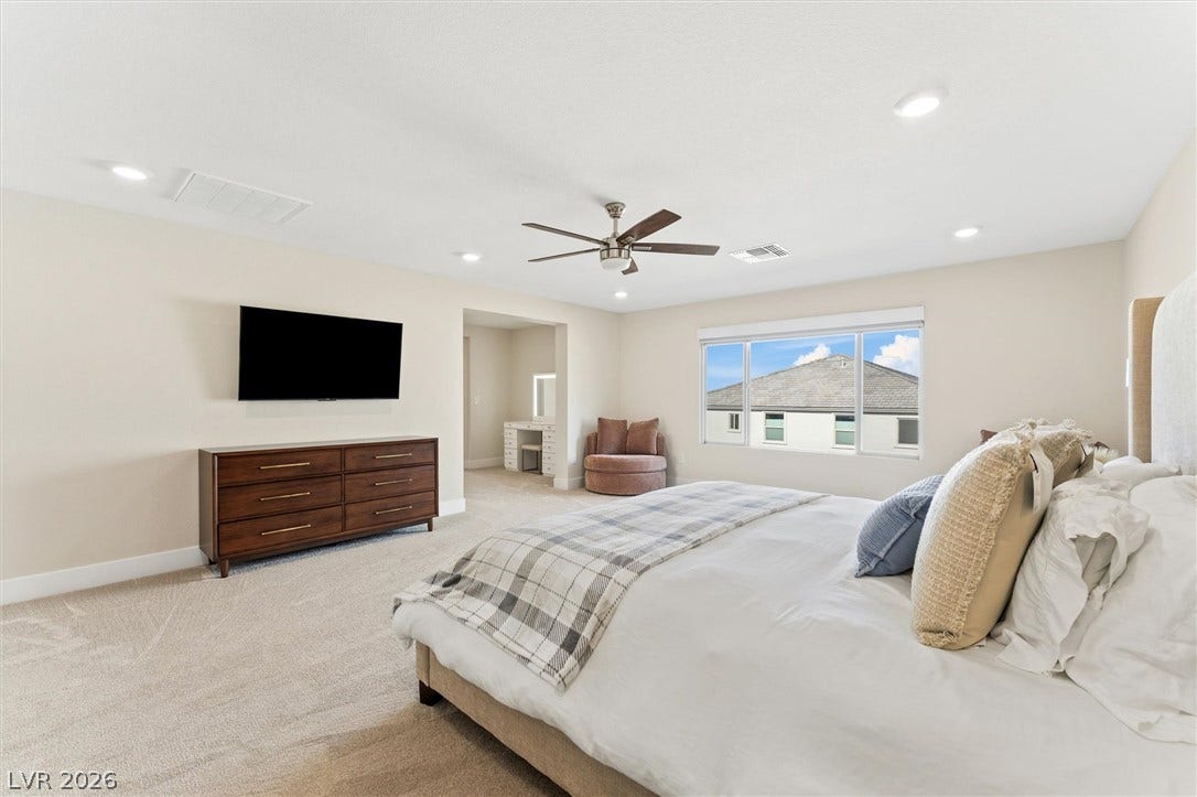8724 Fortplaid Street, Las Vegas, NV 89139 Recessed lighting and soft carpeting create a peaceful retreat in this bedroom.