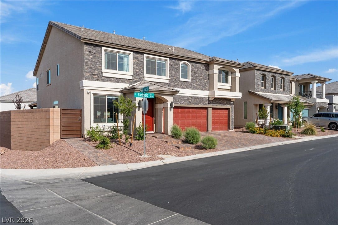 8724 Fortplaid Street, Las Vegas, NV 89139 Striking stone accents and a paved driveway enhance the exterior of this modern residence.